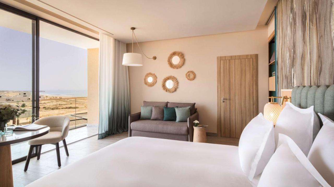 Suite con balcón y vistas parciales al océano - 1 cama extragrande