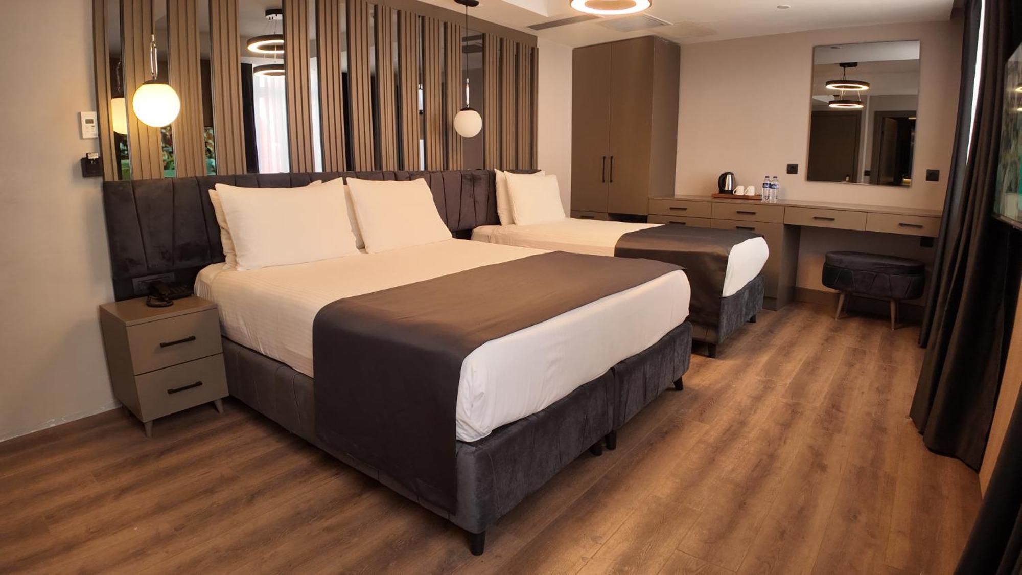 Deluxe Dreibettzimmer