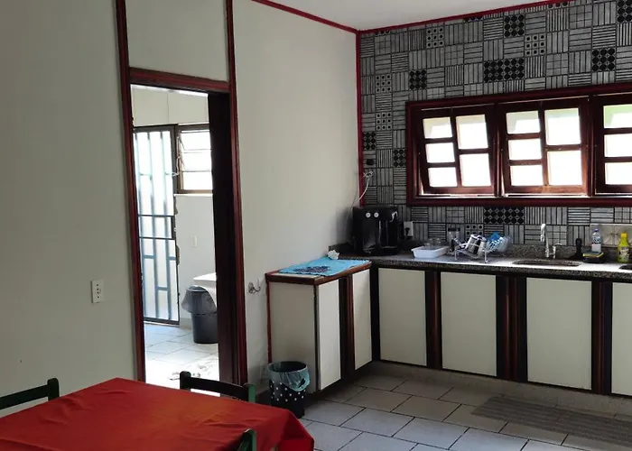 Cama em dormitório da Casa Country