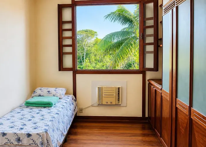 Cama em dormitório da Casa Country